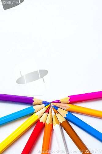 Image of varicolored pencils on white background