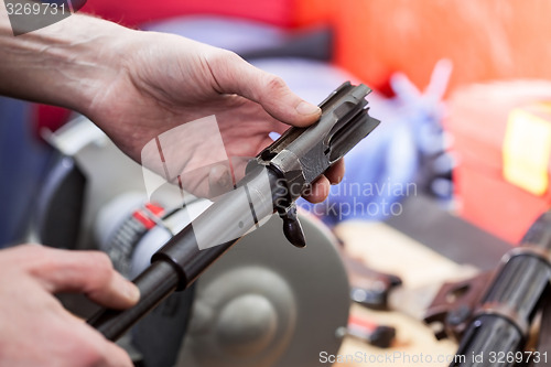 Image of repair of the old German submachine gun MP-38