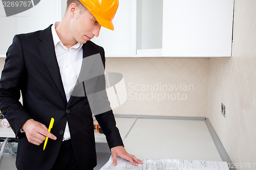 Image of engineer working with documents