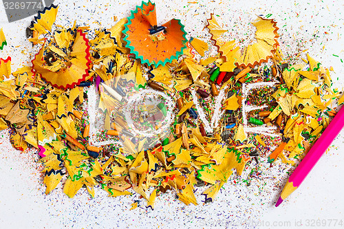 Image of word Love over a shavings of pencils