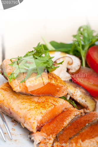 Image of grilled samon filet with vegetables salad