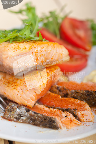 Image of grilled samon filet with vegetables salad