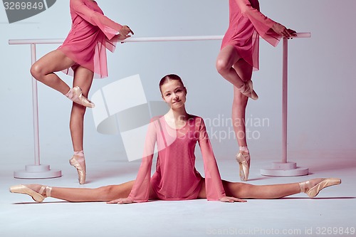 Image of Ballerinas stretching on the bar