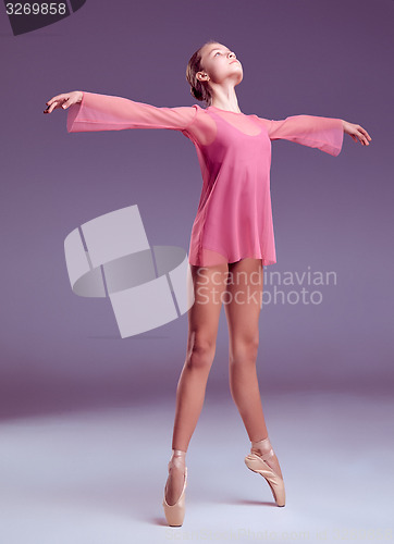 Image of Young ballerina dancer showing her techniques