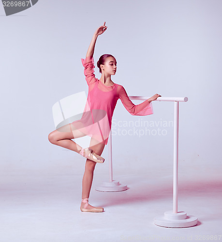 Image of Ballerina stretching on the bar