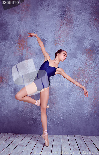 Image of Young ballerina dancer showing her techniques