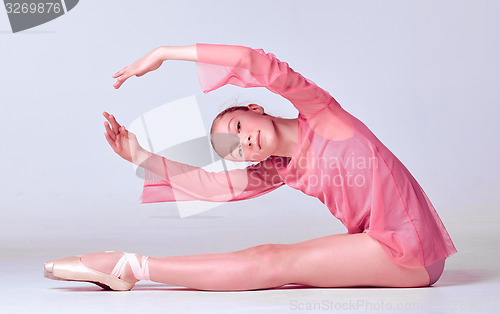 Image of Young ballerina dancer showing her techniques