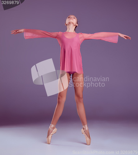 Image of Young ballerina dancer showing her techniques