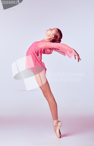 Image of Young ballerina dancer showing her techniques