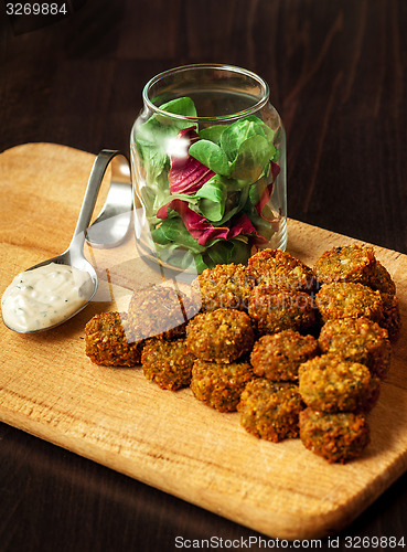 Image of fresh vegetarian falafel  with sauce, selective focus