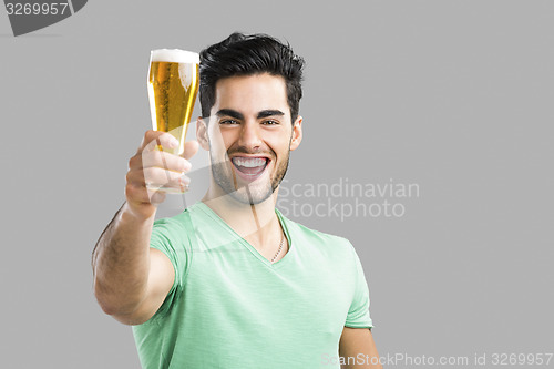 Image of Young man drinking beer