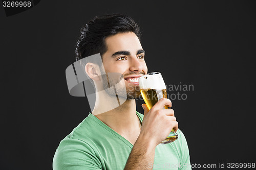Image of Young man drinking beer