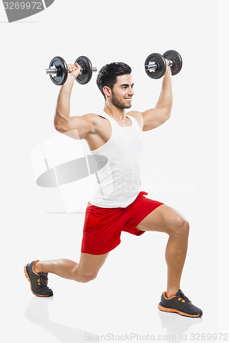 Image of Athletic man lifting weights