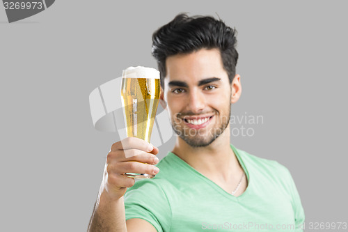 Image of Young man drinking beer