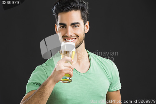 Image of Young man drinking beer