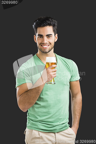 Image of Young man drinking beer