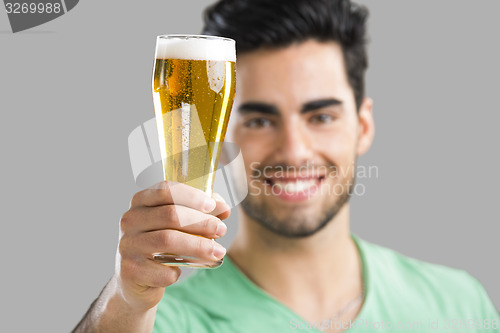 Image of Young man drinking beer