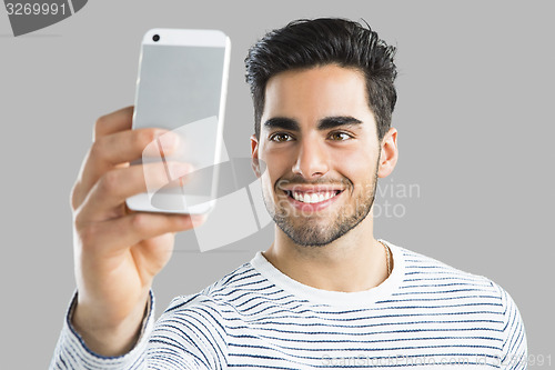 Image of Handsome man making a selfie