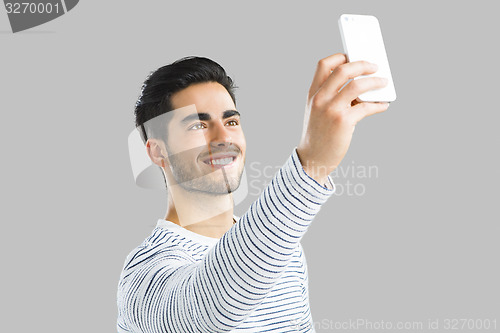 Image of Handsome man making a selfie