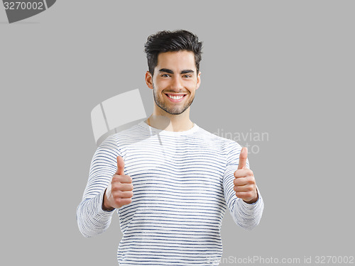 Image of Handsome man with thumbs up