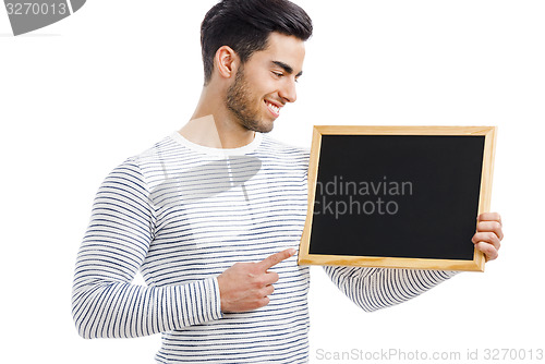 Image of Man holding a chalkboard