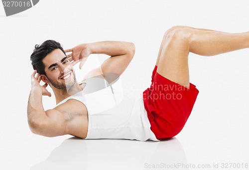 Image of Athletic man doing ABS