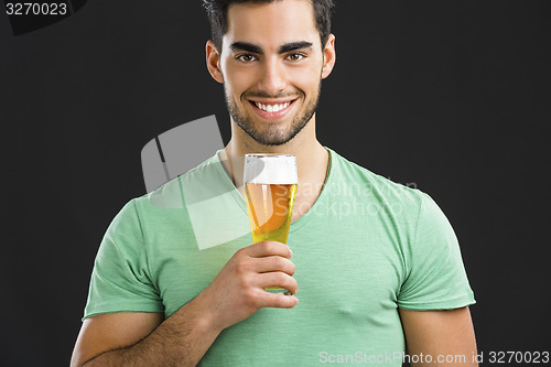 Image of Young man drinking beer