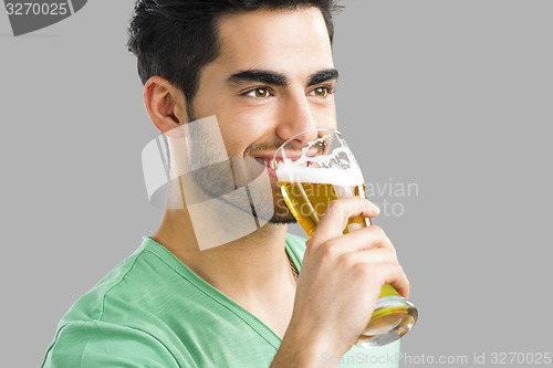 Image of Young man drinking beer