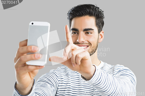Image of Handsome man making a selfie