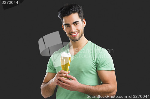 Image of Young man drinking beer