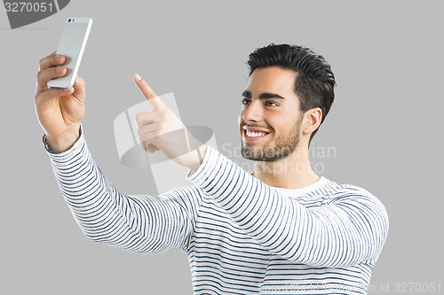 Image of Handsome man making a selfie