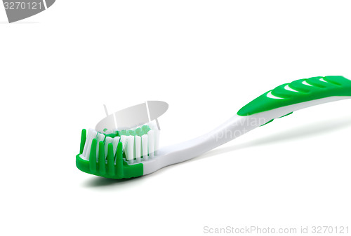 Image of Green toothbrush on white background