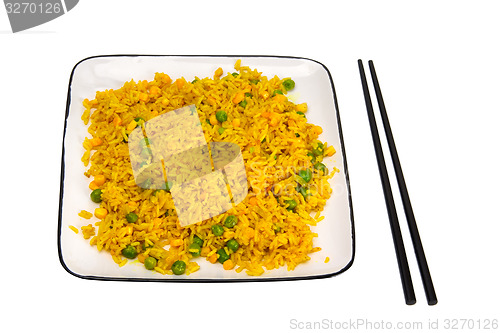 Image of Rice with vegetables and chopsticks