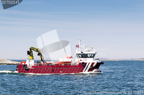 Image of working boat with crane