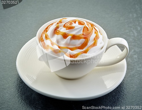 Image of caramel latte coffee with whipped cream