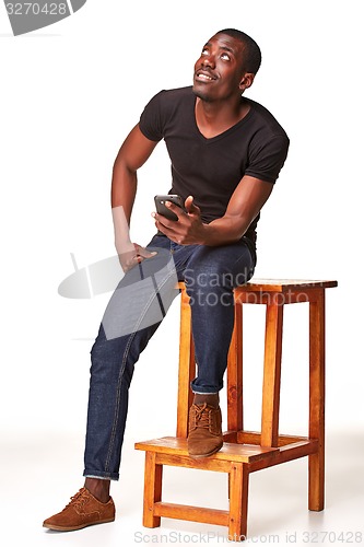 Image of Portrait of african man talking on the phone