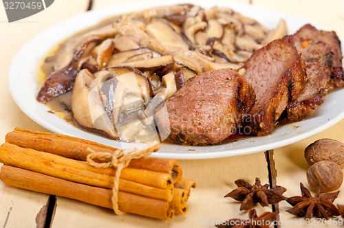 Image of venison deer game filet and wild mushrooms