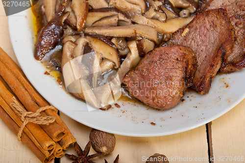 Image of venison deer game filet and wild mushrooms