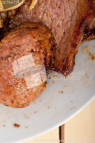 Image of venison deer game filet and wild mushrooms