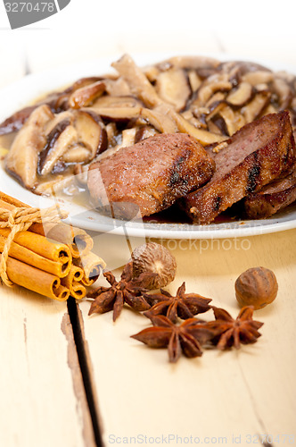 Image of venison deer game filet and wild mushrooms