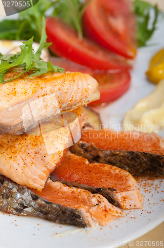 Image of grilled samon filet with vegetables salad