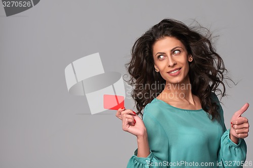 Image of Business woman holding credit card