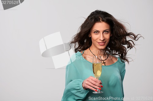 Image of Party woman holding glass with champagne