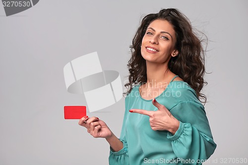 Image of Business woman holding credit card