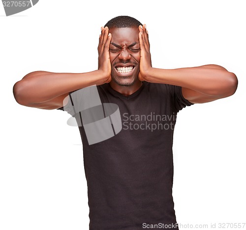 Image of Black man holding his head in pain and depression