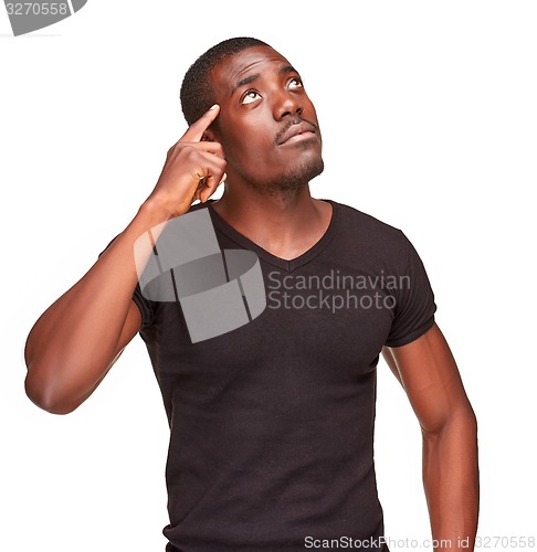 Image of Young  black african man thinking and reminiscing about something