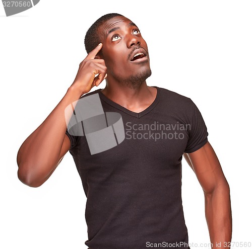 Image of Young  black african man thinking and reminiscing about something