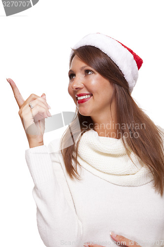 Image of Attractive smiling woman in a Santa hat