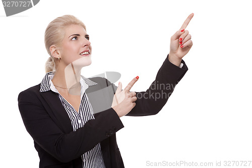 Image of Businesswoman Pointing Up While Looking at Camera