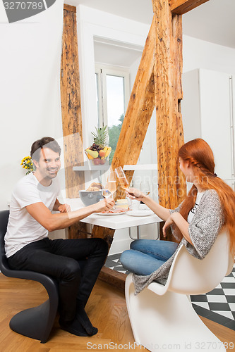 Image of Couple Preparing Ham Sandwich at the Table